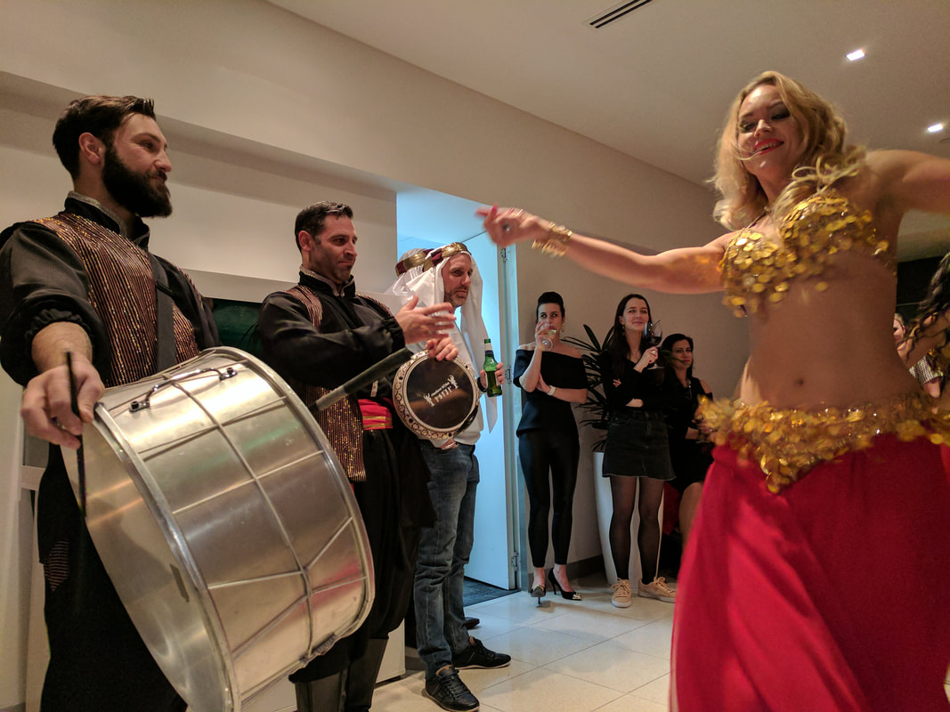 Hire a Belly dancer and drummer